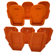 A collection of orange 3D printed tool and battery holders with the branding 'AEG' printed on them.