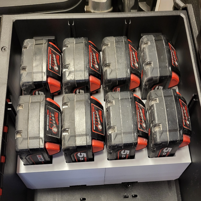 Set of battery packs in a storage compartment