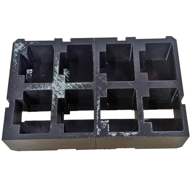 A black plastic battery holder insert designed for the Milwaukee PACKOUT 2-Drawer System, capable of holding 8 M18 batteries.