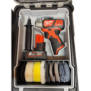Milwaukee power tool set with drill, battery, and sanding discs in a case.