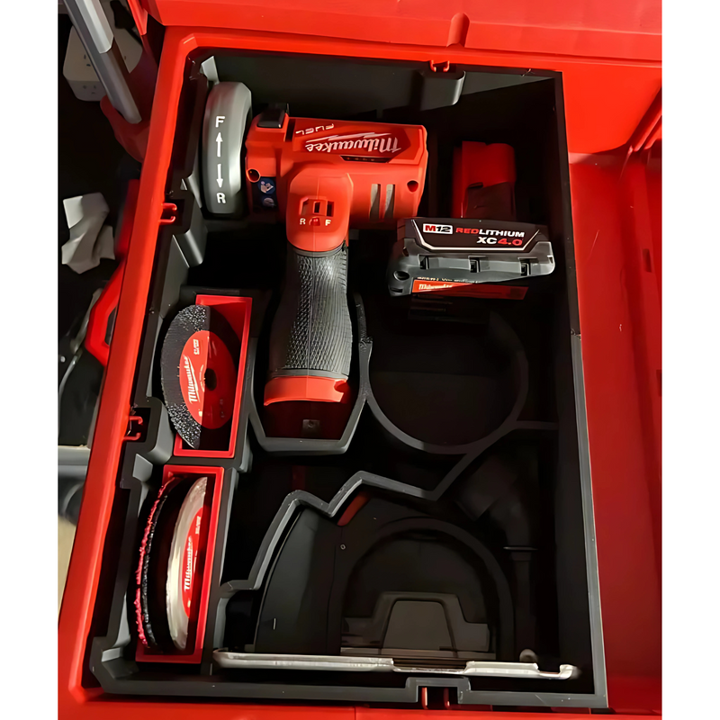 Red Milwaukee power drill and battery pack inside a toolbox