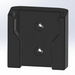 Black rectangular object with two circular holes on a light gray background