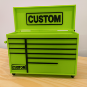 Green tool chest with 'CUSTOM' branding on a wooden surface