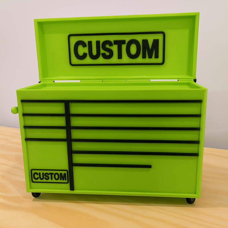 Green tool chest with 'CUSTOM' branding on a wooden surface