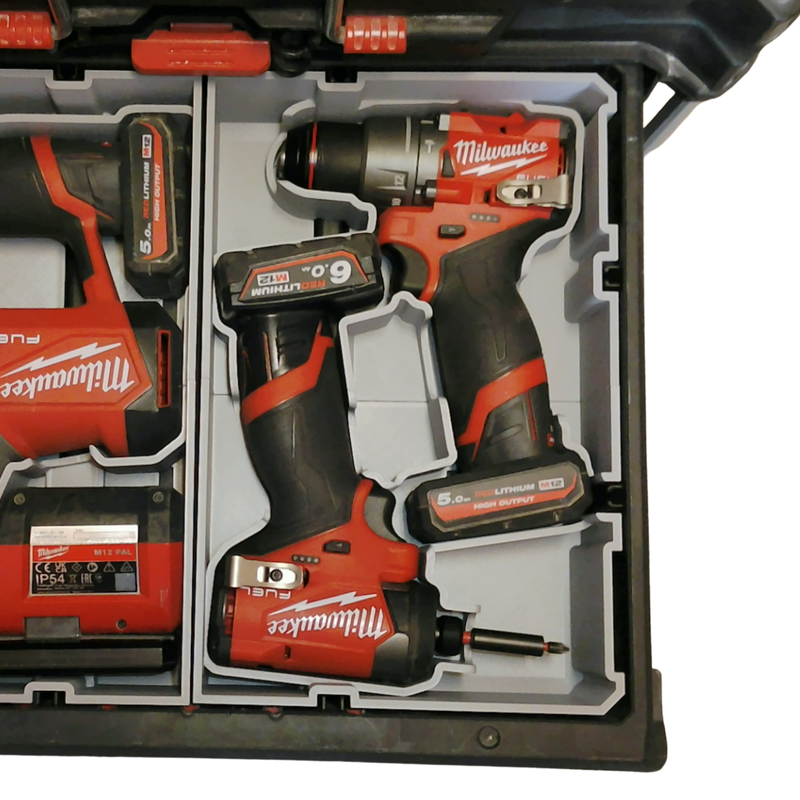 Milwaukee power tool set with drill and battery in a case
