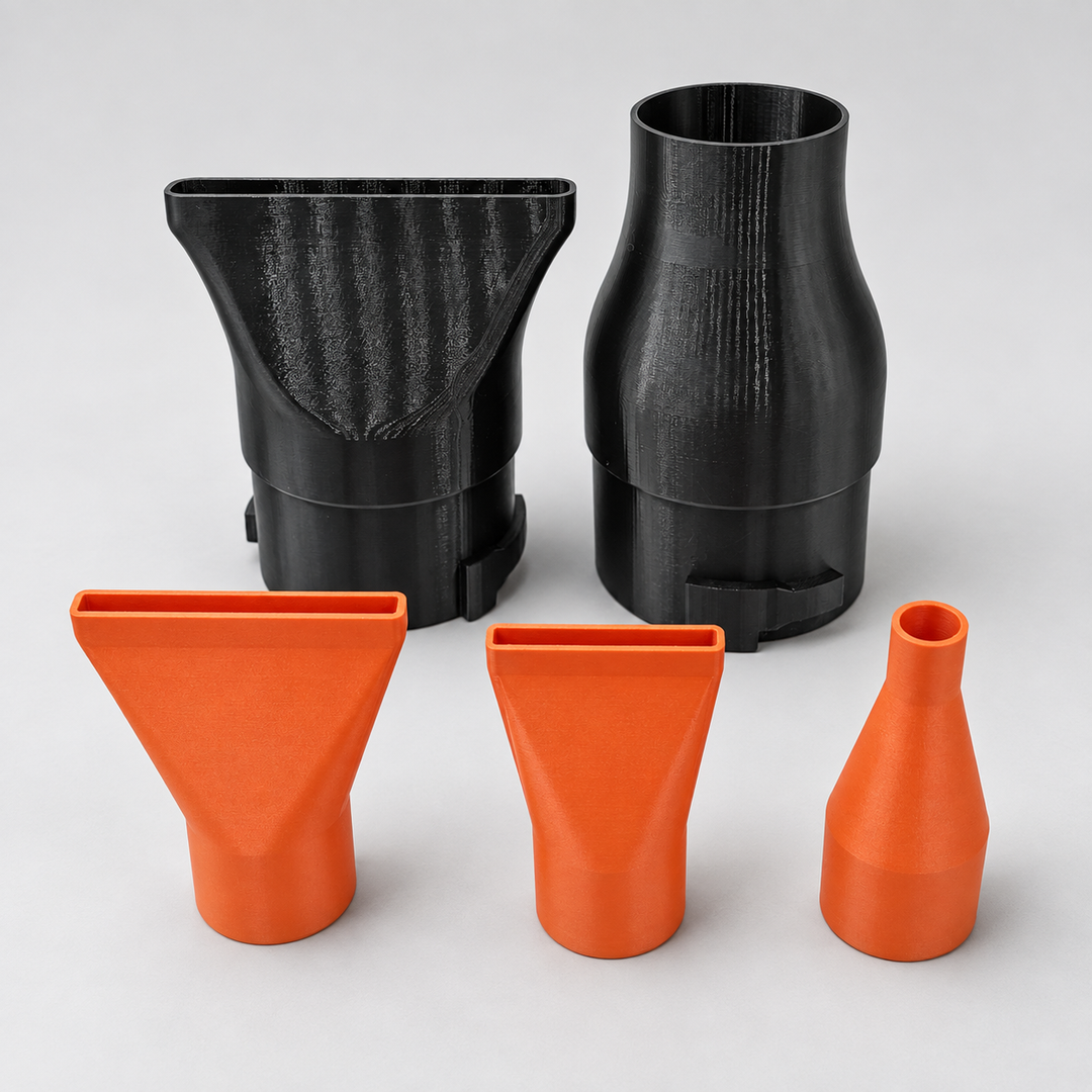 Blower nozzle attachments on a grey studio background