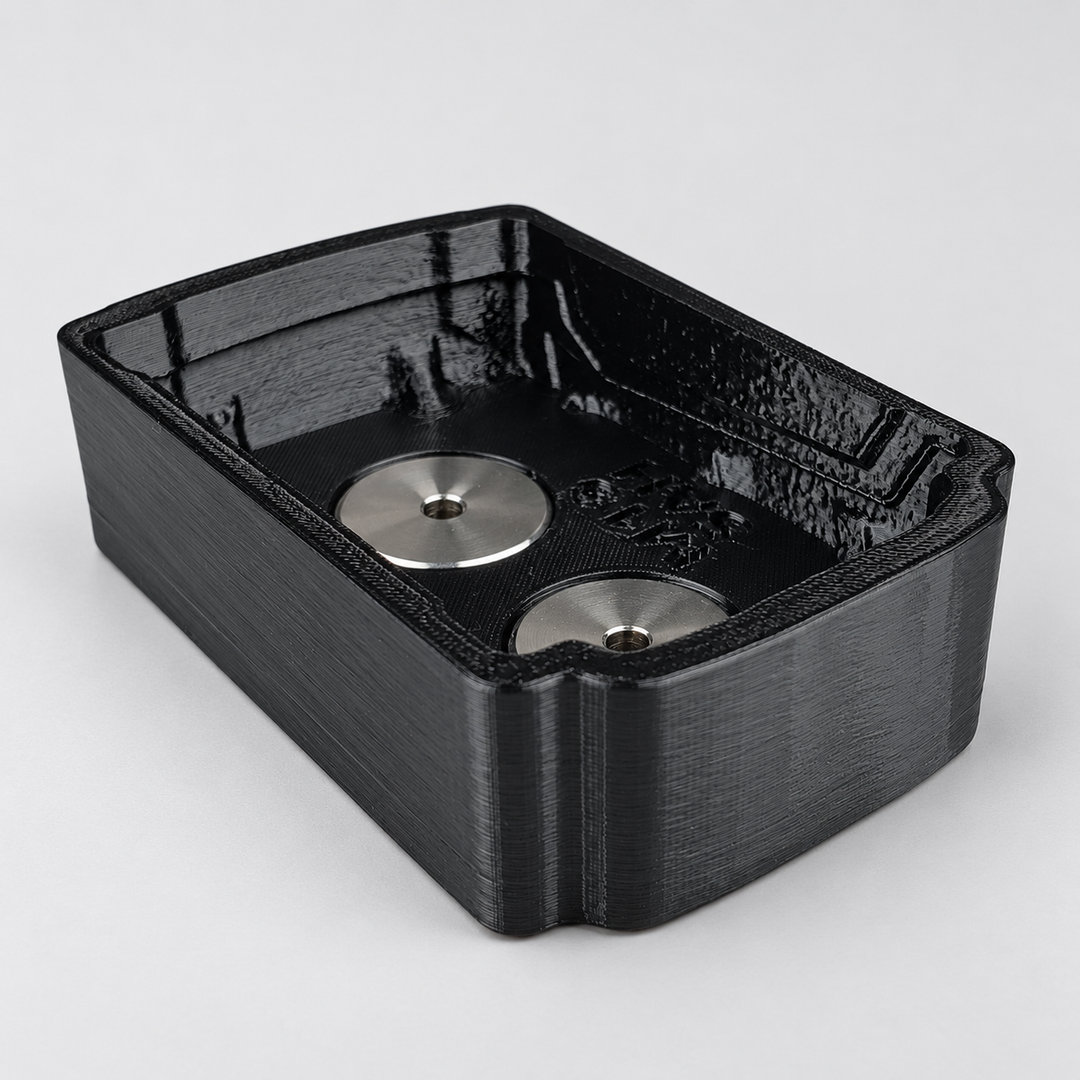 Black magnetic battery base cover with two silver magnets visible inside.
