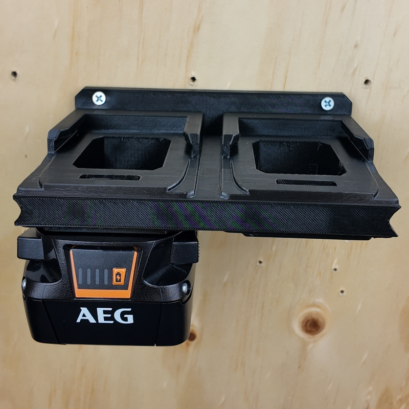 AEG 18V battery holder mounted flush against a wall