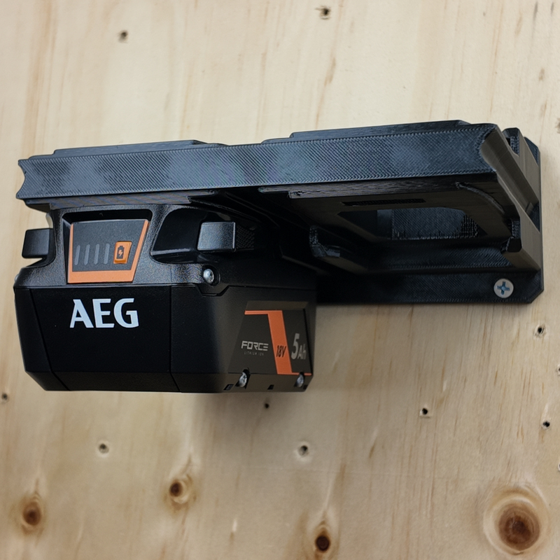Empty AEG 18V battery wall rack showing the foot-mount slots