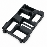 Black five-slot M18 battery holder insert with accessory tray on white background, angled view