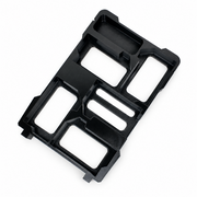 Black five-slot M18 battery holder insert with accessory tray on white background, overhead view