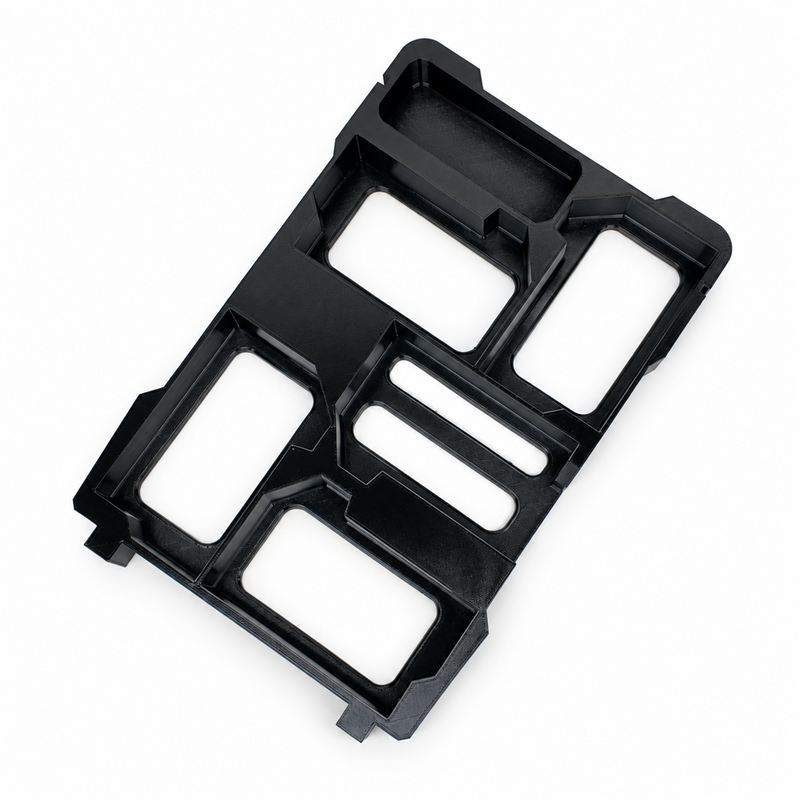 Black five-slot M18 battery holder insert with accessory tray on white background, overhead view