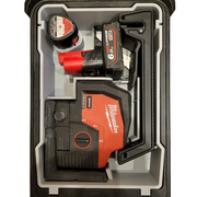 An M12 laser insert within a Milwaukee Compact Packout Organiser, featuring compartments for a laser tool and accessories, displayed in black, red, and gray colors.