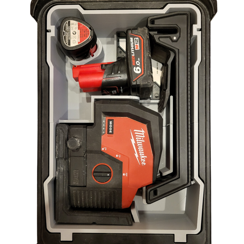An M12 laser insert within a Milwaukee Compact Packout Organiser, featuring compartments for a laser tool and accessories, displayed in black, red, and gray colors.