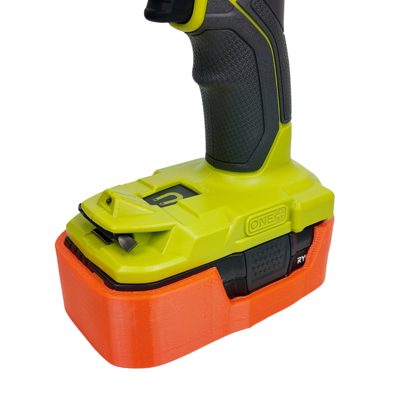 Orange magnetic battery case for Ryobi ONE+ 18V, close-up of the case fitted beneath a drill.