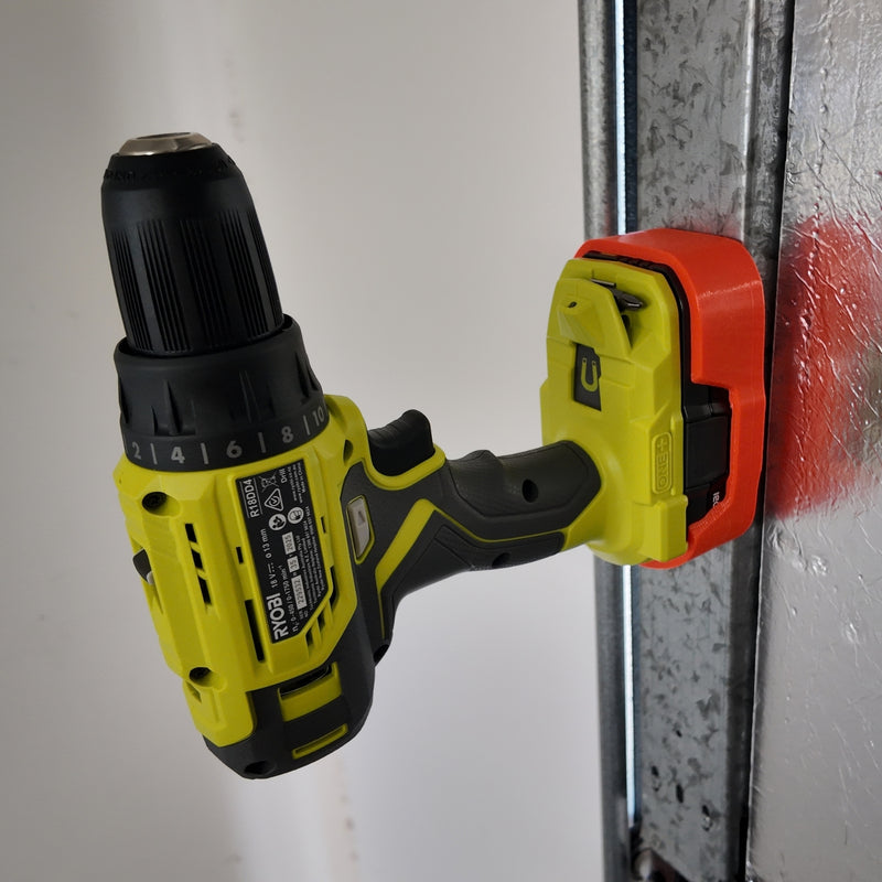 Orange magnetic battery case for Ryobi ONE+ 18V, drill attached sideways to a steel post.