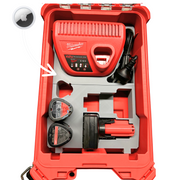 Red Milwaukee tool kit with battery and accessories on a white background