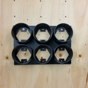 Spray can wall holder shown holding 70mm aerosol cans