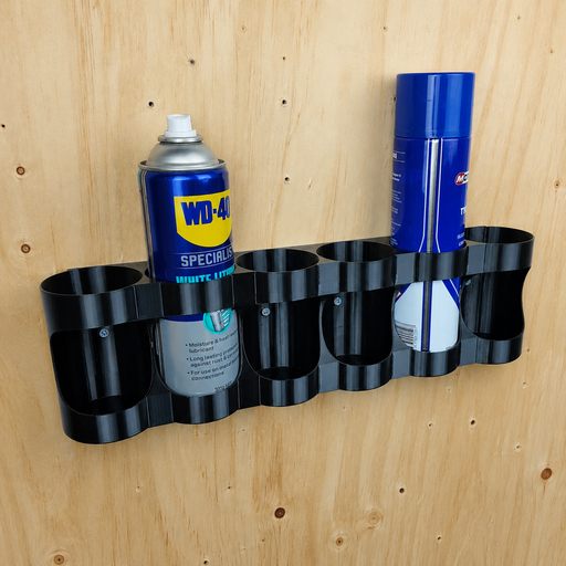 Spray can wall mount holder with six slots holding aerosol cans in a shed
