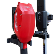 Wall mount for a Milwaukee M18 whipper snipper power head, black bracket holding a red power head, side view.